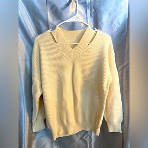 Knit pullover with neckline detail. Size small, cream colored, brand unknown.